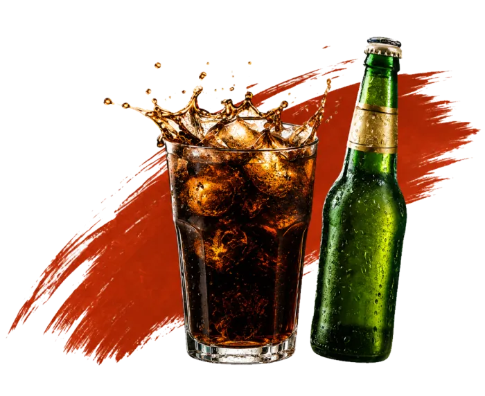 Glass of cola with ice and a beer bottle